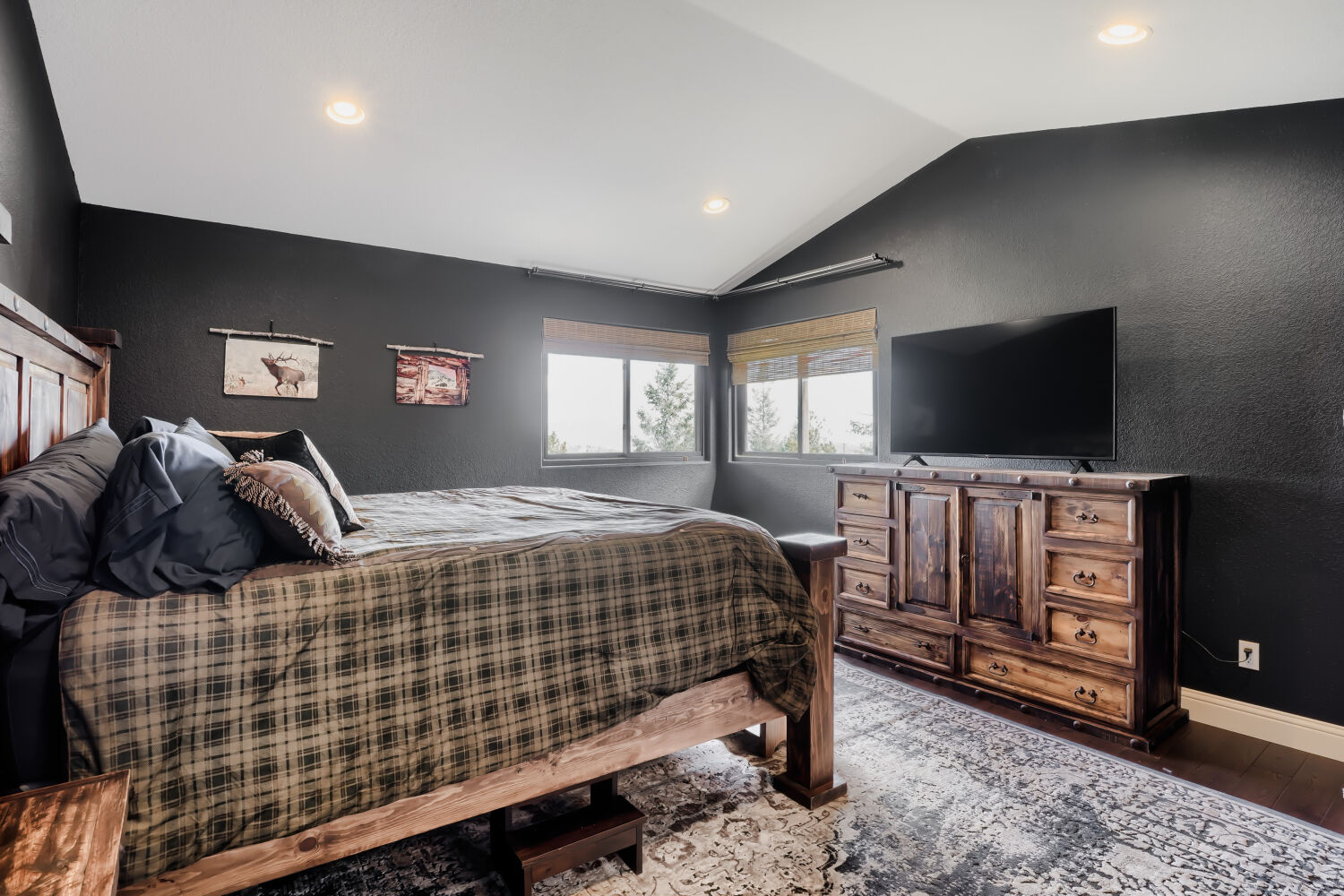 Primary bedroom with forest views